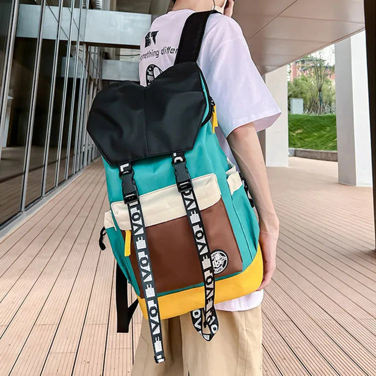 Oxford cloth backpack in black, green, or red with adjustable carrying straps.