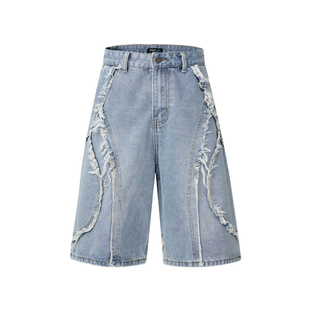 Distressed blue denim shorts with raw edge hem on a plain background, showing straight leg cropped fit.