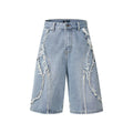 Distressed blue denim shorts with raw edge hem on a plain background, showing straight leg cropped fit.