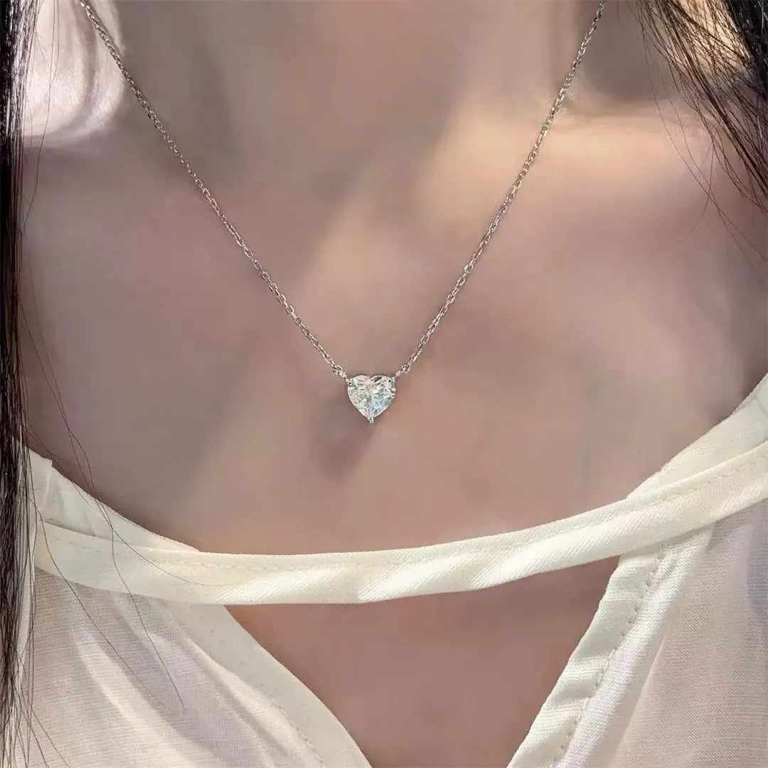 Silver women's necklace with heart-shaped pendant on copper chain