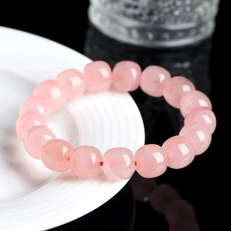 Pink crystal barrel bead bracelet with geometry design and polished finish