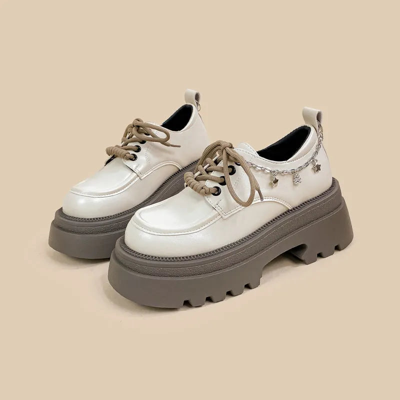 White Mary Jane platform shoes with chunky heel and front lace-up fastening