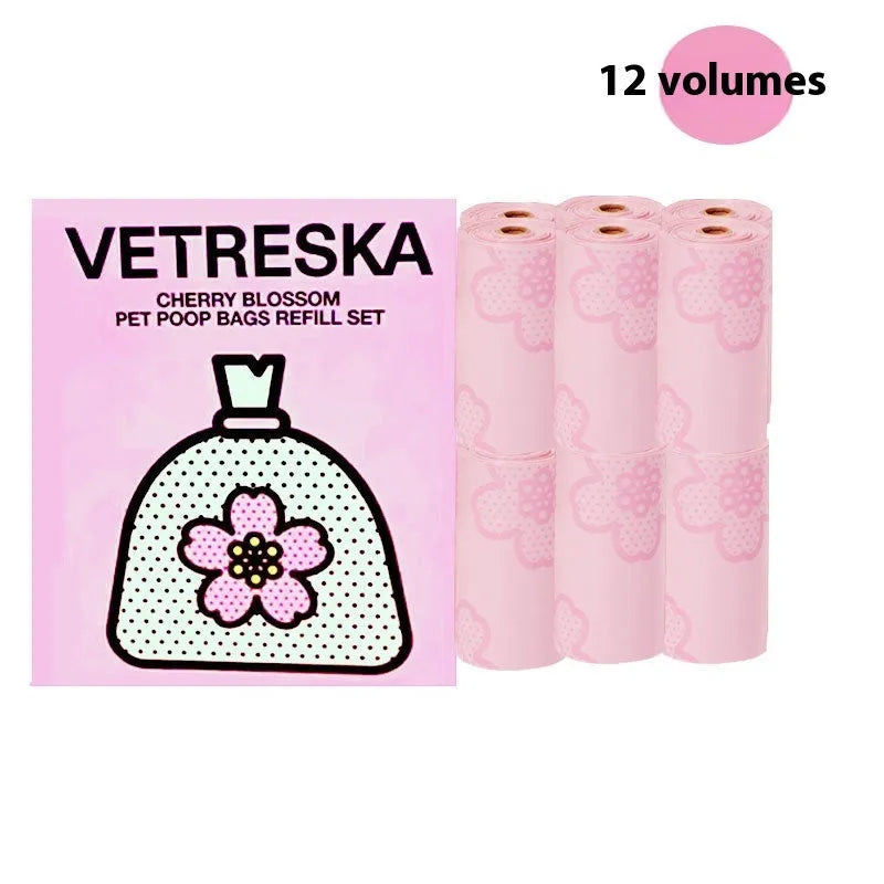Portable dog poo bag dispenser capsule with strawberry design and a roll of scented biodegradable bags.