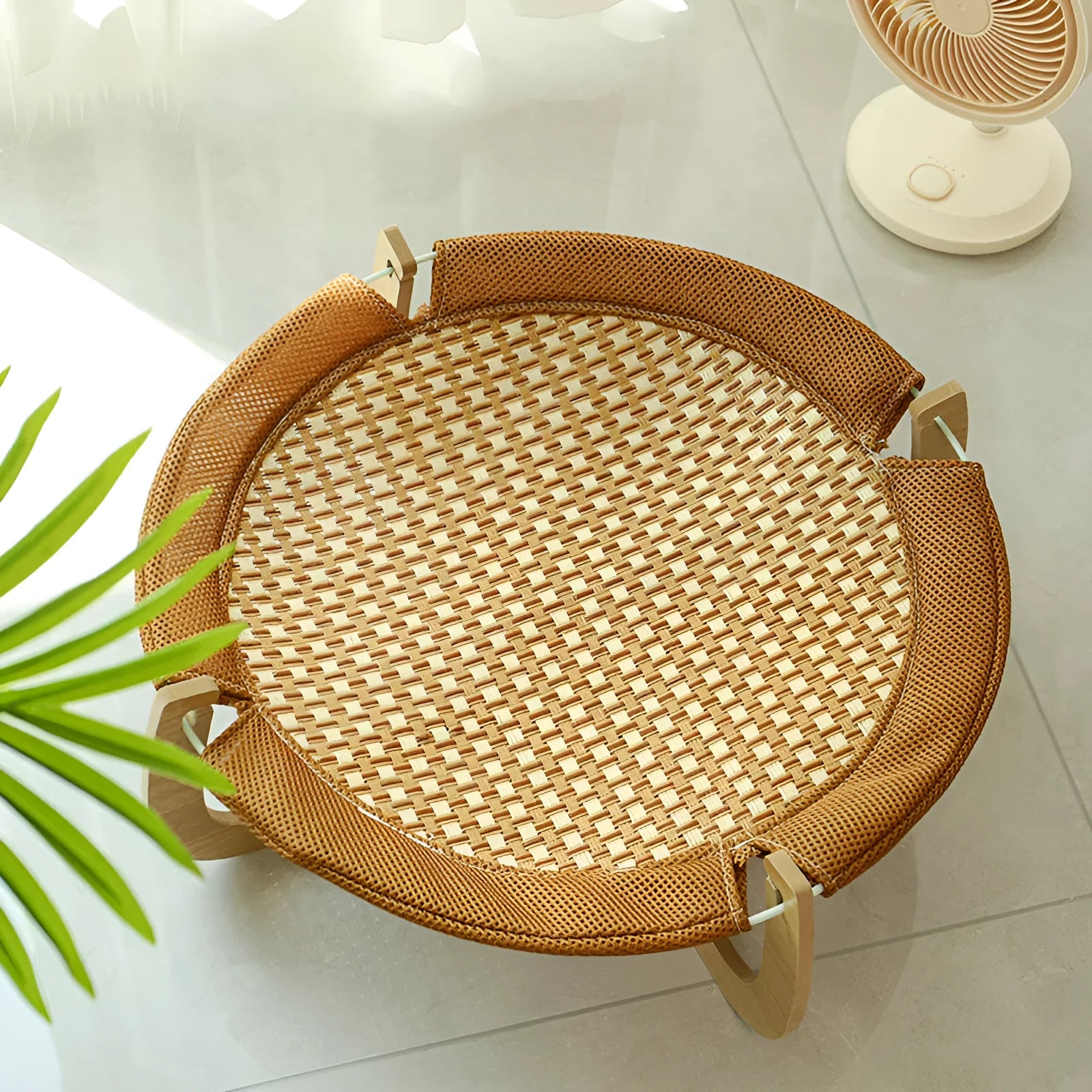 Brown rattan woven elevated pet bed measuring 46cm square with 17.5cm height