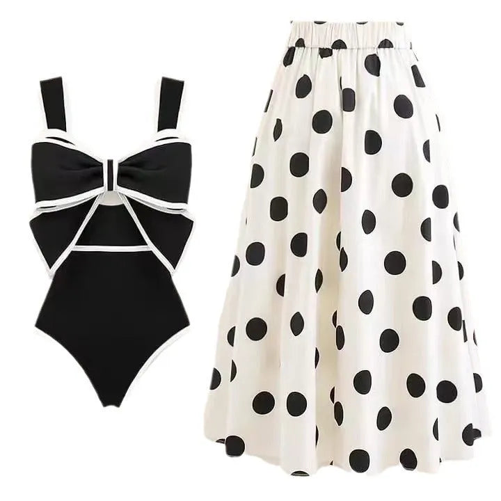Female one-piece swim dress with round skirt and bow detail in polyester fabric