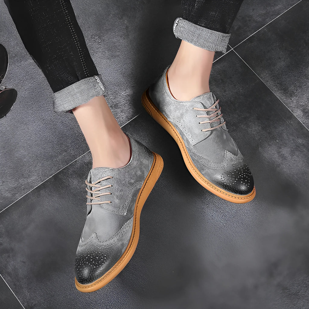 Men's black genuine cowhide leather lace-up business shoes with rubber sole on a grey background.