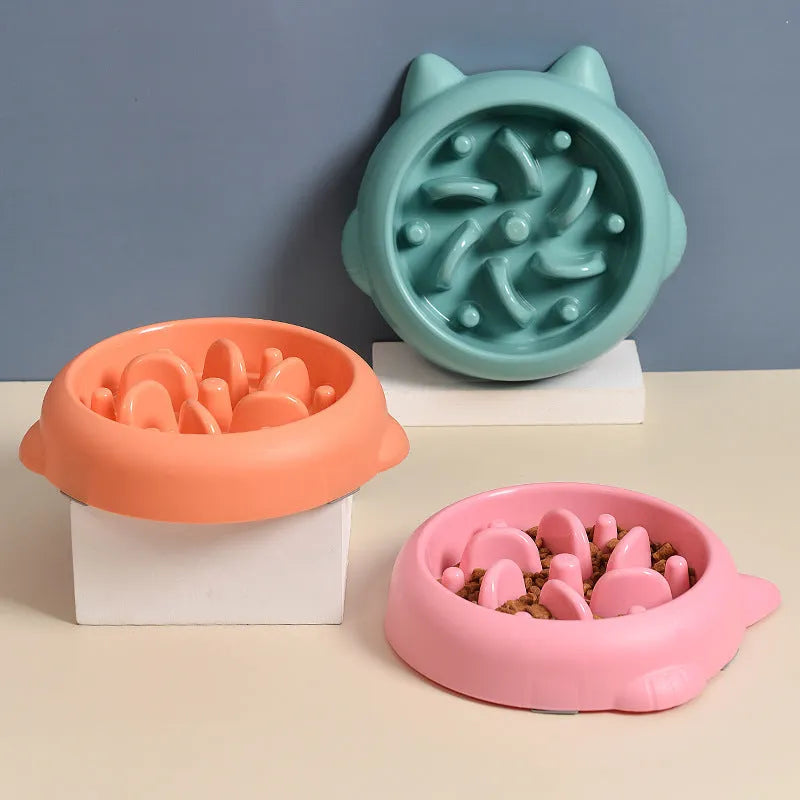 Green slow feeder dog bowl with raised bone-shaped ridges inside