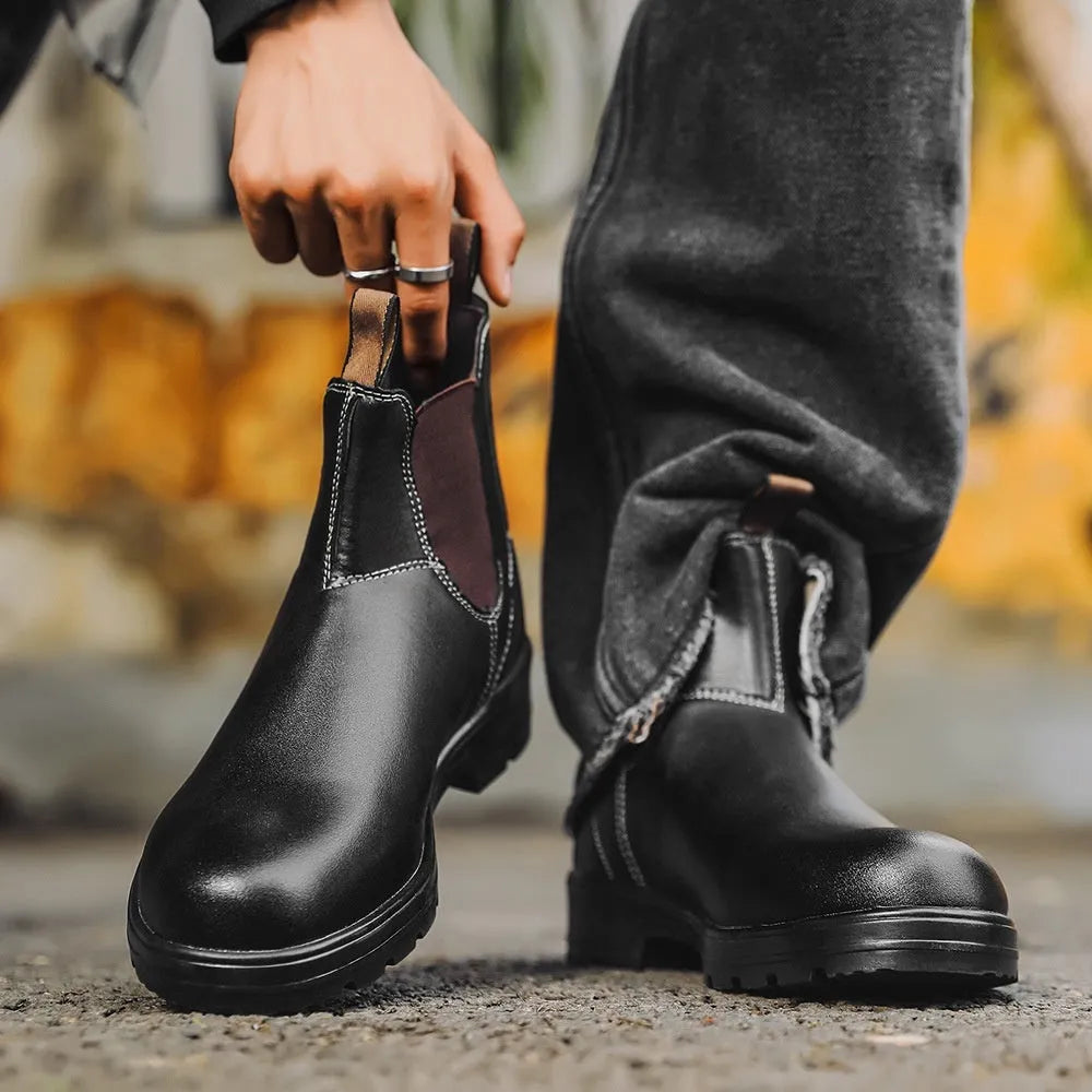Unisex vintage brown Chelsea boots with a chunky sole and round toe on a white background