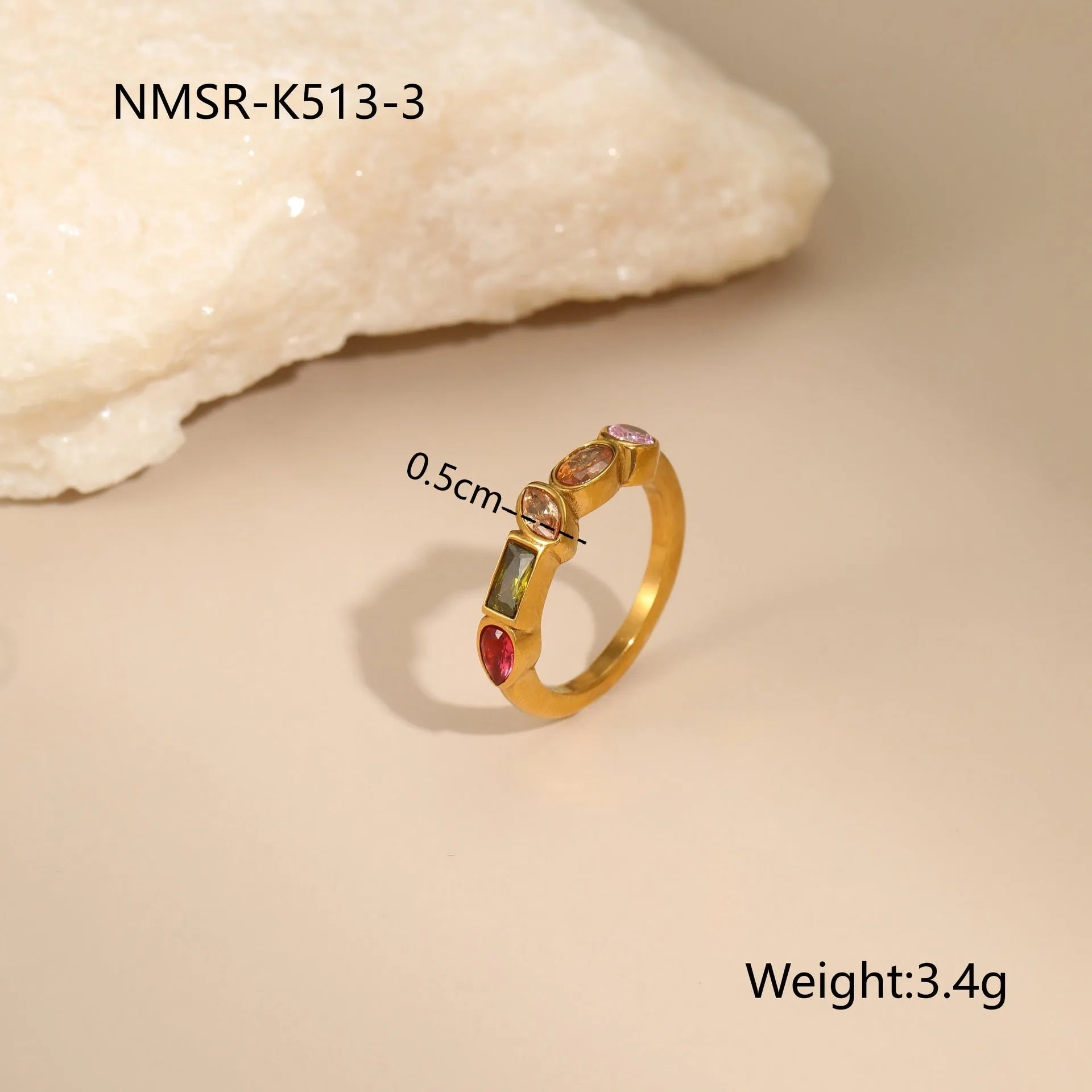 Geometric gold-plated necklace, ring, and earrings set with an adjustable chain on a grey background.