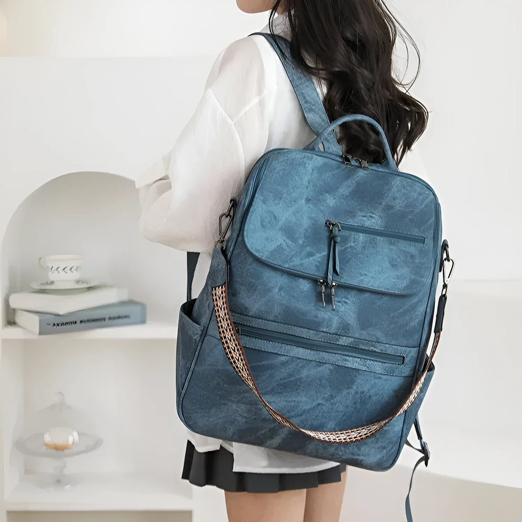 Retro style PU leather college backpack with curved shoulder straps, shown in one of six colour options.