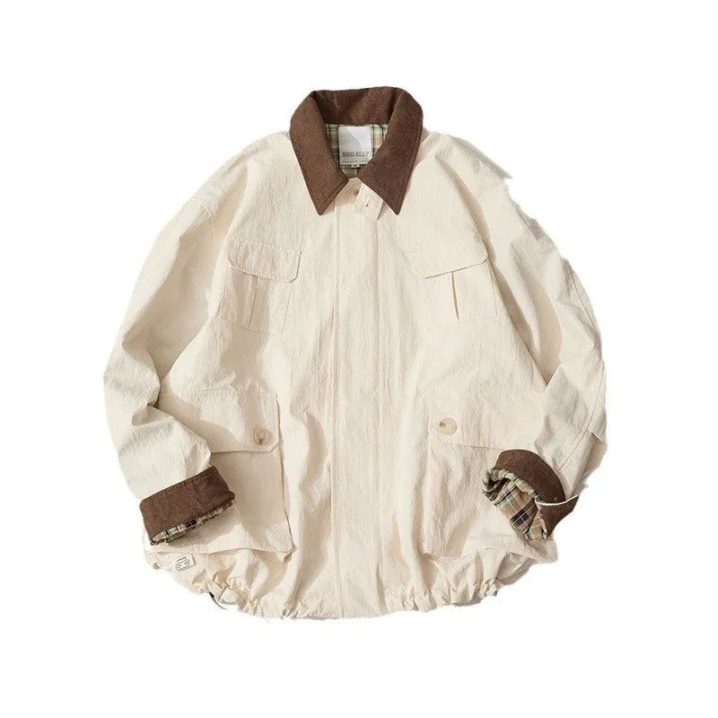 Green unisex casual jacket with contrast colour panels and side seam pockets on a model.