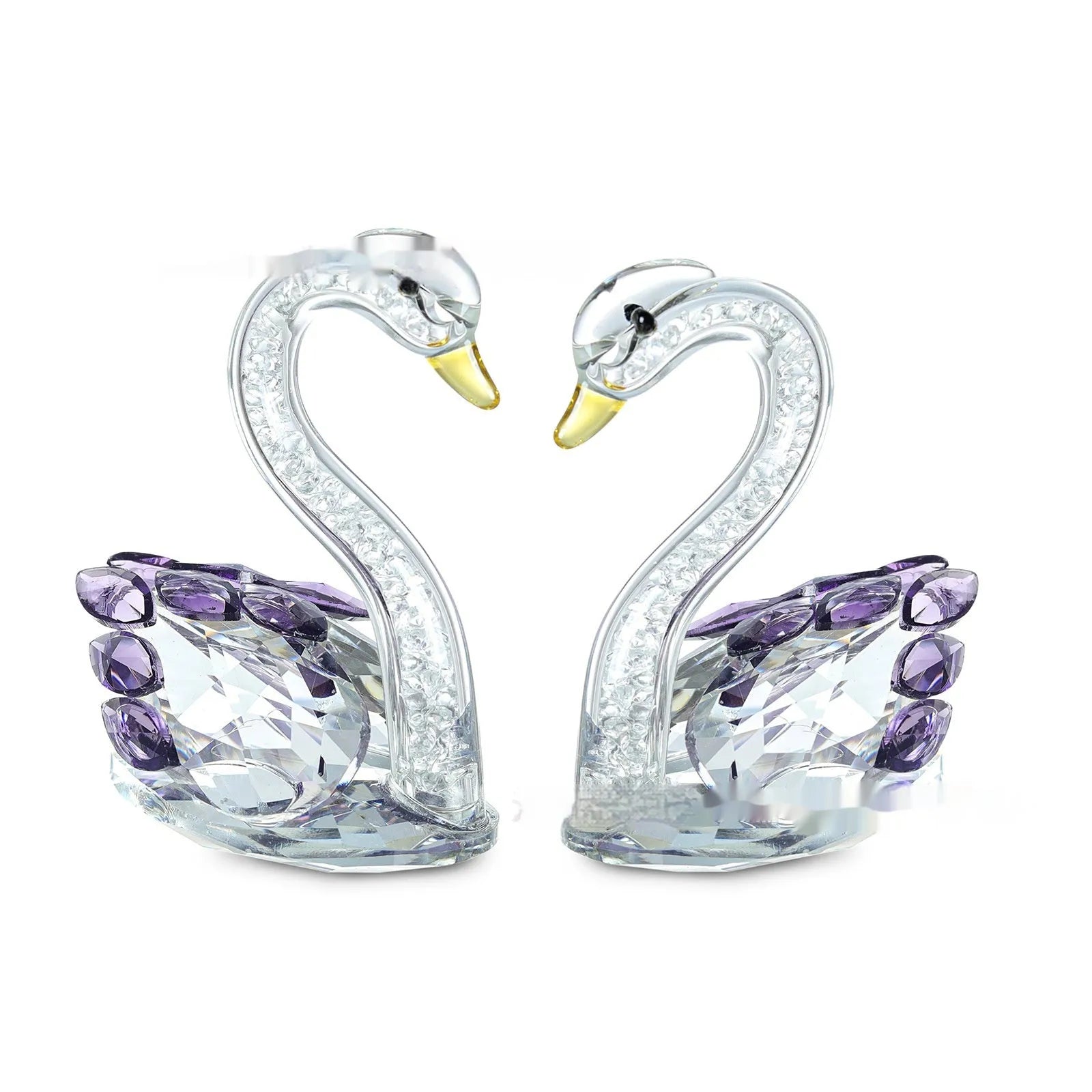 Crystal swan desktop ornament in red, blue, pink, or purple on a wooden surface.