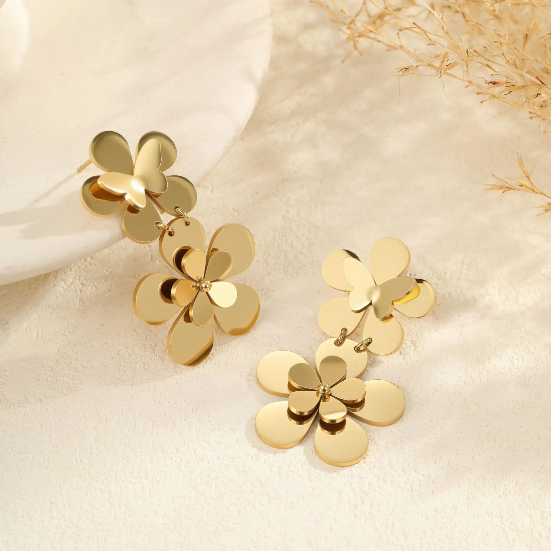 Gold electroplated stainless steel flower butterfly earrings for women with geometric zodiac design