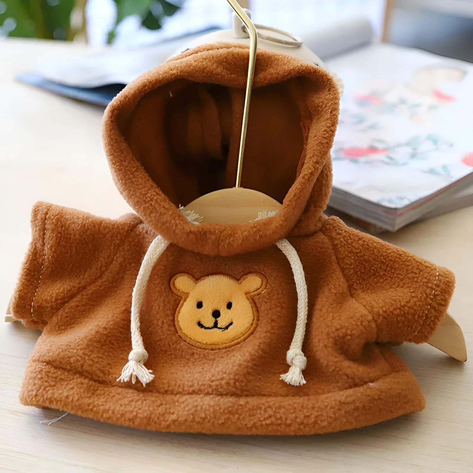 Blue cloth dog hoodie sweater showing hood up design for pet wear