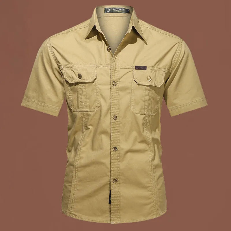 Men's loose fit cotton short sleeve work shirt in cardigan style on a hanger