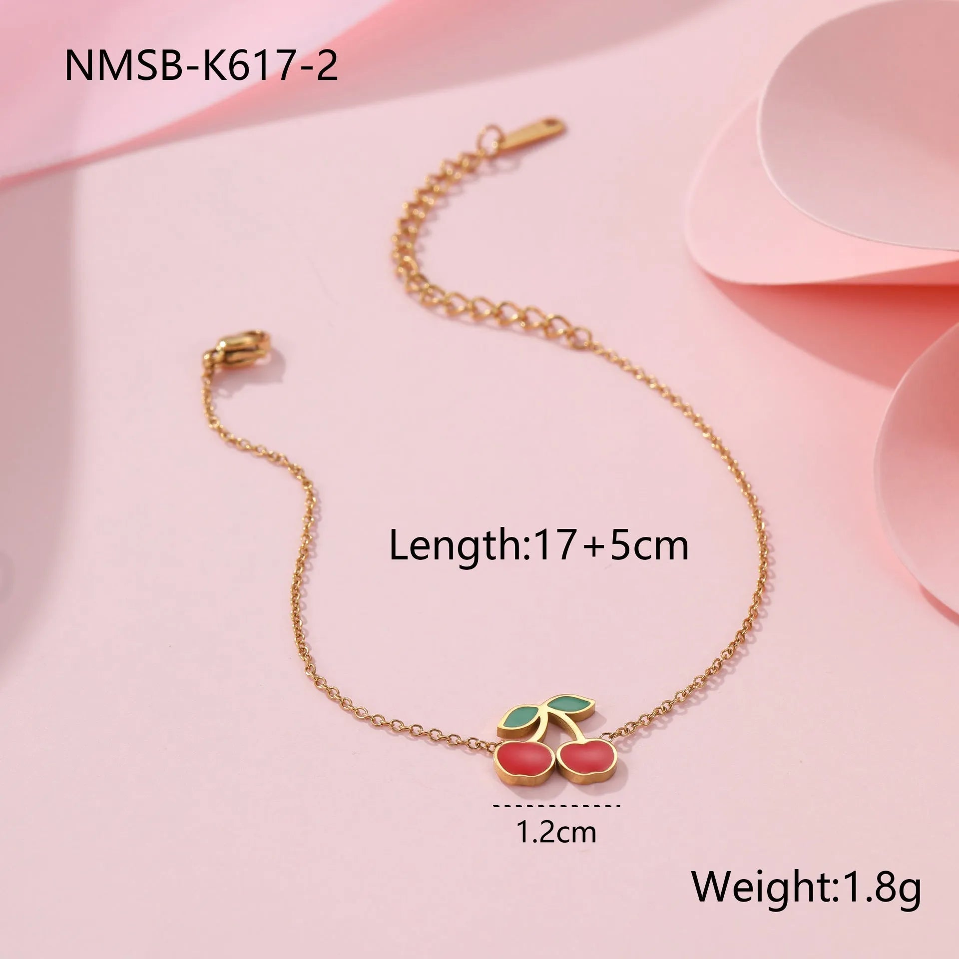 Cherry jewellery set showing necklace, bracelet, earrings, and ring with stainless steel construction and cherry fruit design