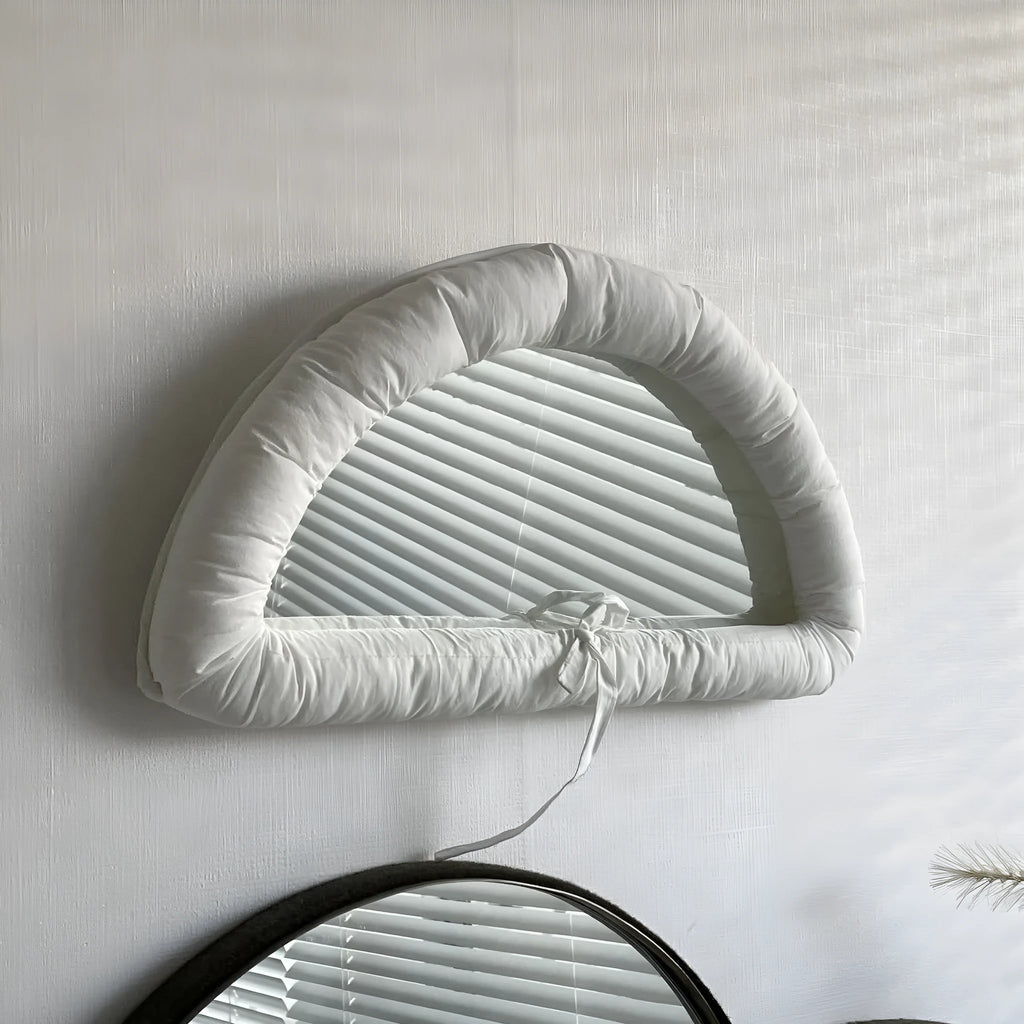 Hanging cotton-filled fabric mirror in white, black or sapphire blue measuring 23x40x5cm