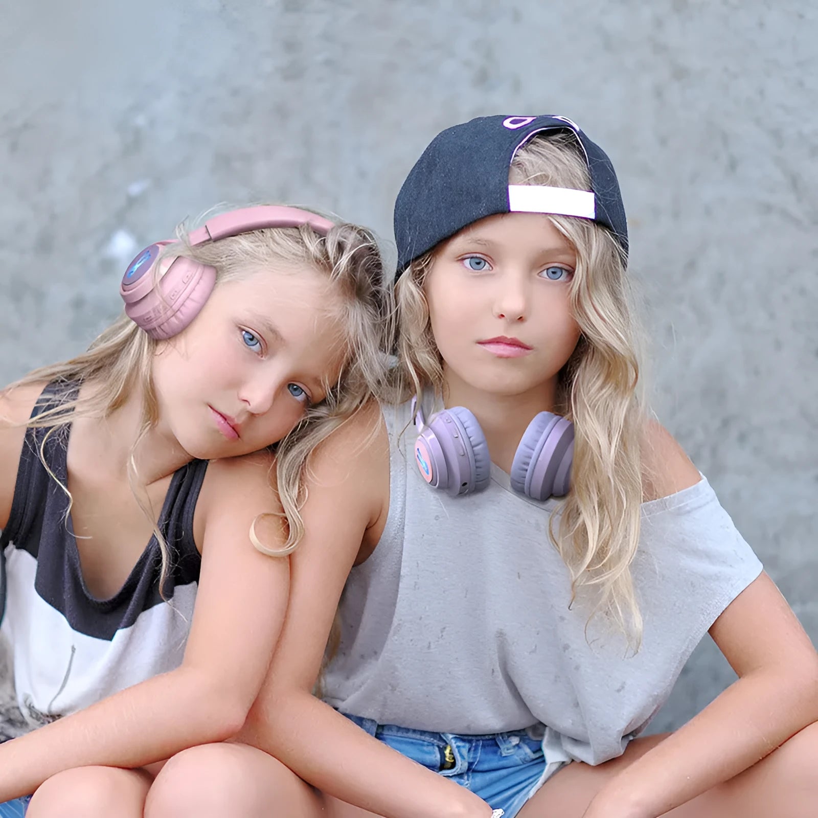 Wireless RGB LED headphones for children in bunny pink with lights illuminated