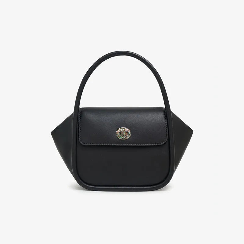 Soft cow leather wing-shaped tote handbag with a buckle and cross-body strap in four colour options.
