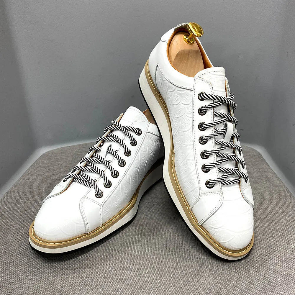 Men's low-top shoes with a handmade embossed pattern on the upper and front lace closure.