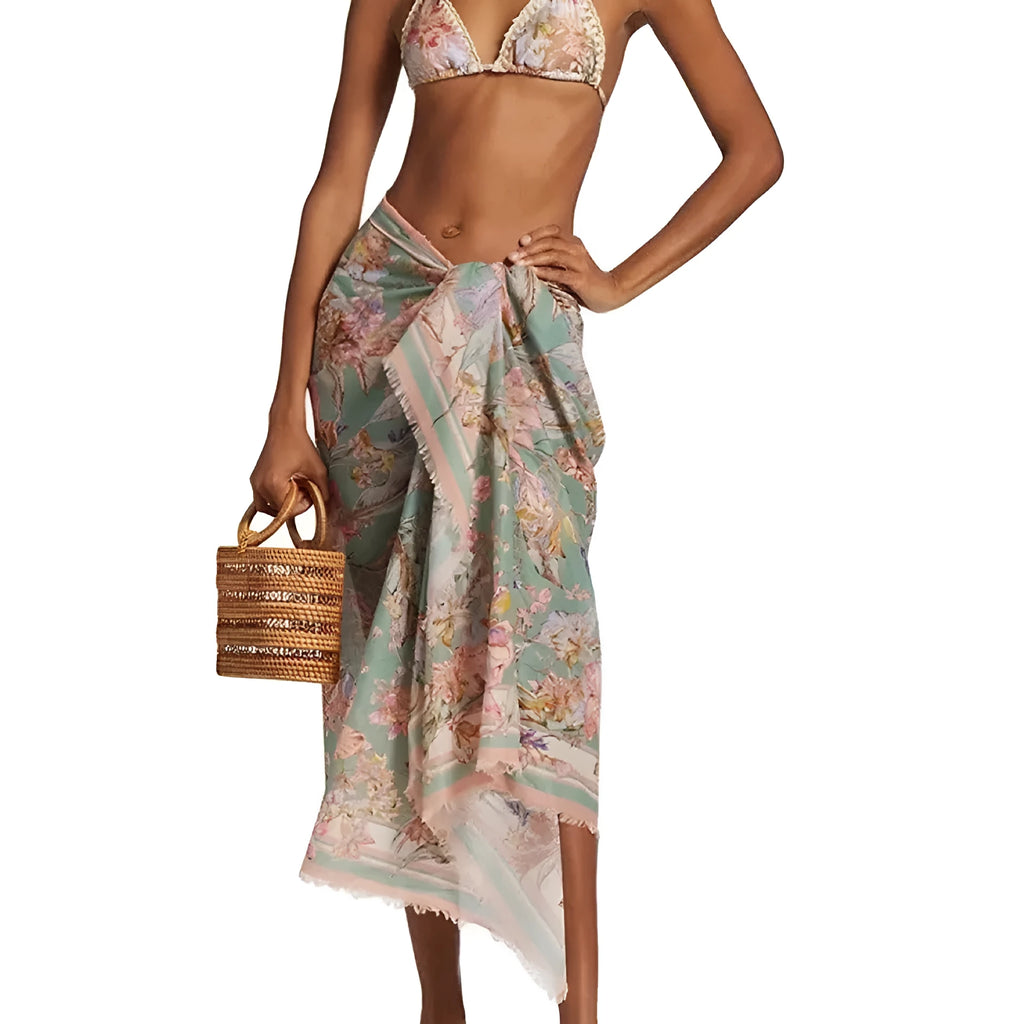 Women's creamy-white floral bikini swimsuit set with skirt, top, and briefs in nylon fabric