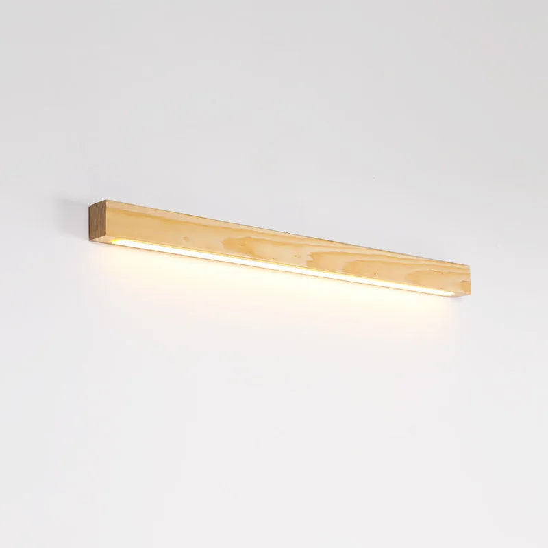 Walnut coloured log strip wall lamp with a square wood and acrylic profile mounted on a wall.