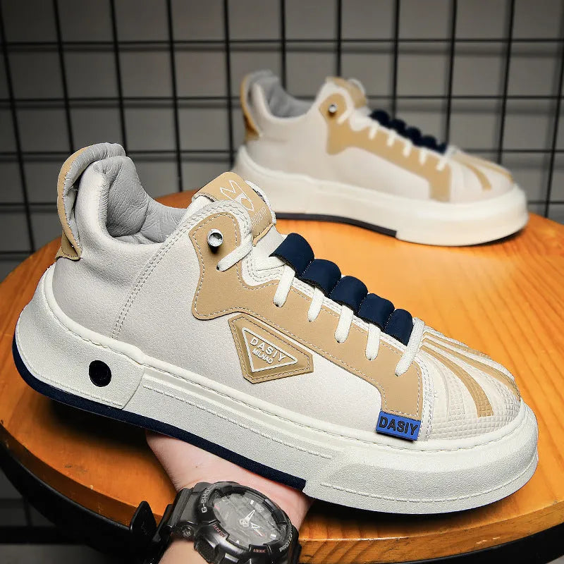 Men's beige low-top casual sneakers with elastic band and leather stitch details on microfiber upper.