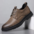 Men's black and brown cowhide leather sneaker shoes with rubber soles and decorative sewing lines.