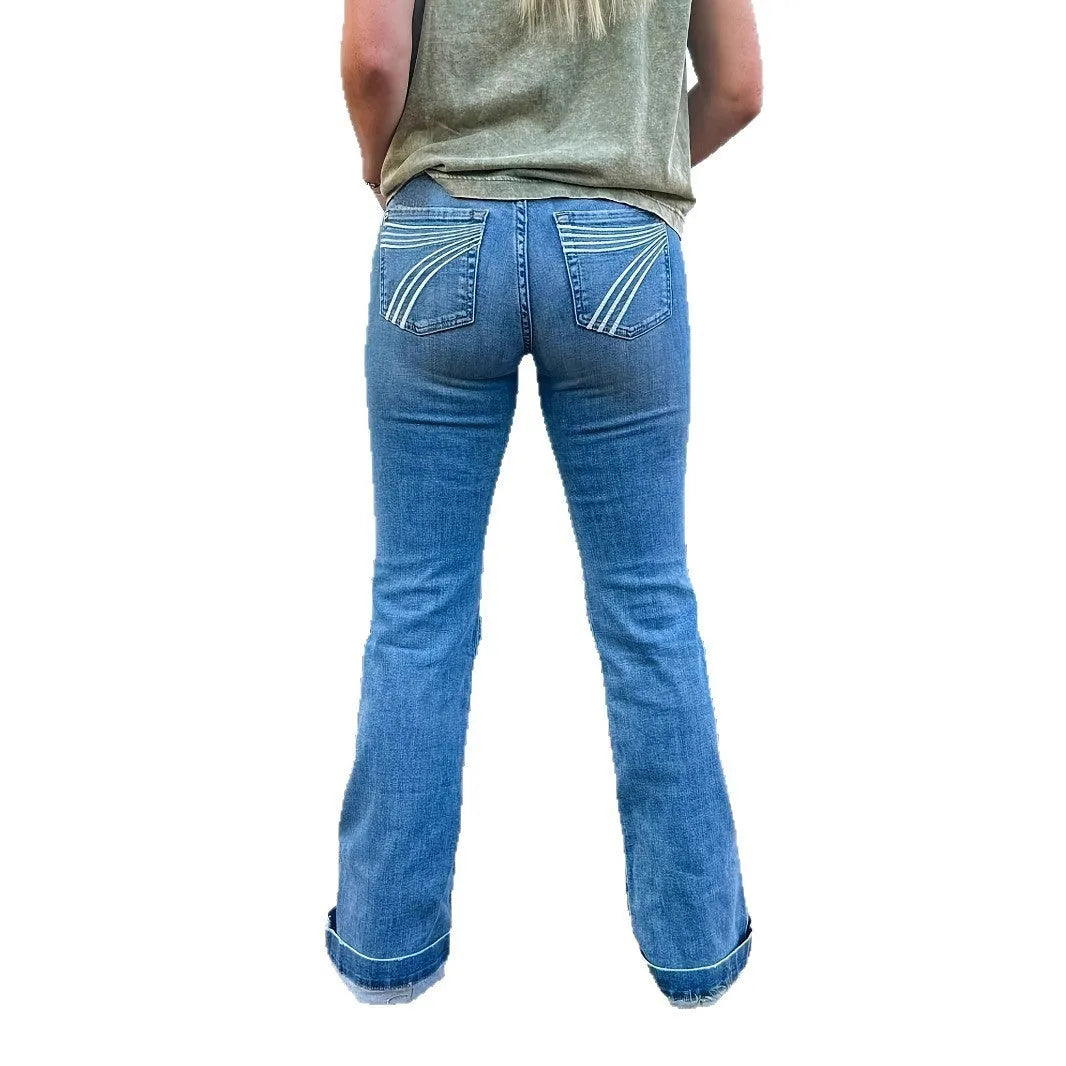 Slim fit jeans with mid-waist and slight flare showing embroidery detailing and micro-elastic construction