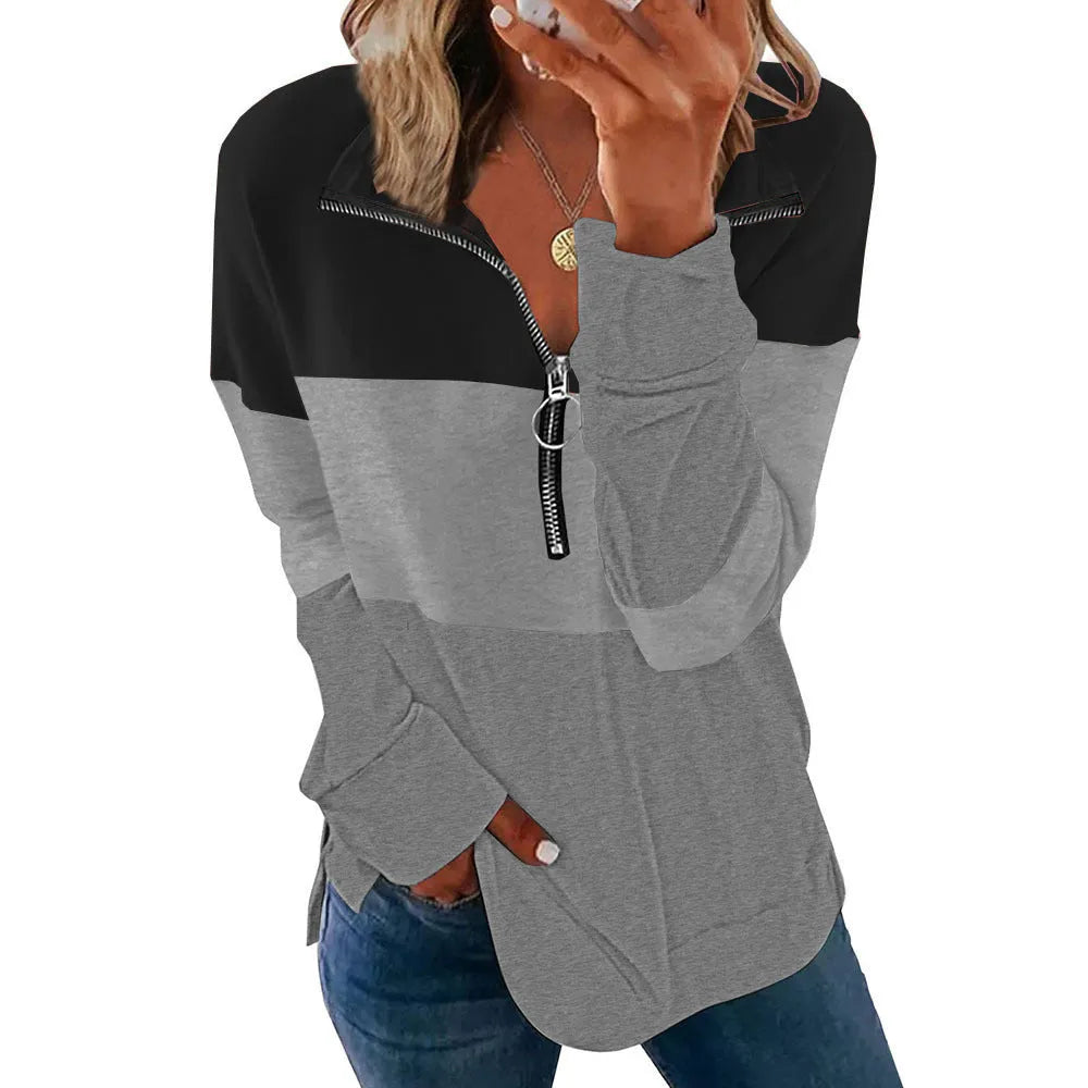 Women's loose long-sleeved leopard print sweater in polyester fabric on a hanger.