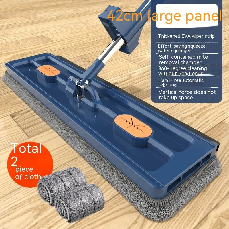 Large flat mop with long stainless steel handle and blue cleaning cloth on a hard floor.