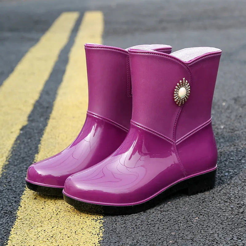 Women's purple PVC rain boots with non-slip sole and middle tube design