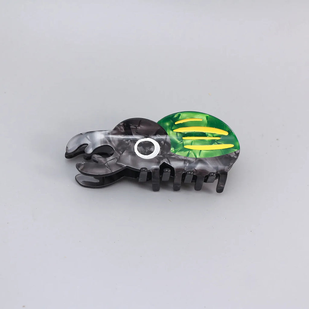 Handmade cellulose acetate insect biology beetle grip in green beetle design