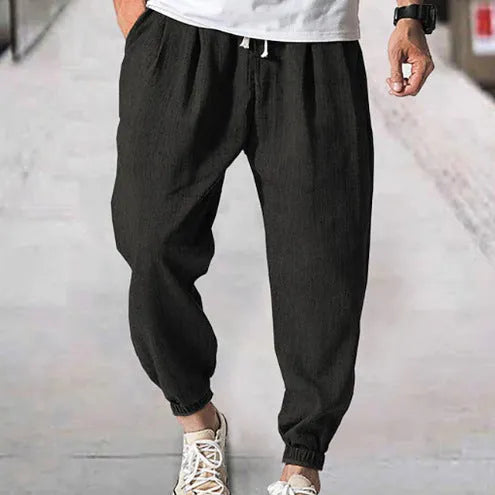 Men's loose cotton summer trousers with banded ankle cuff in light green colour
