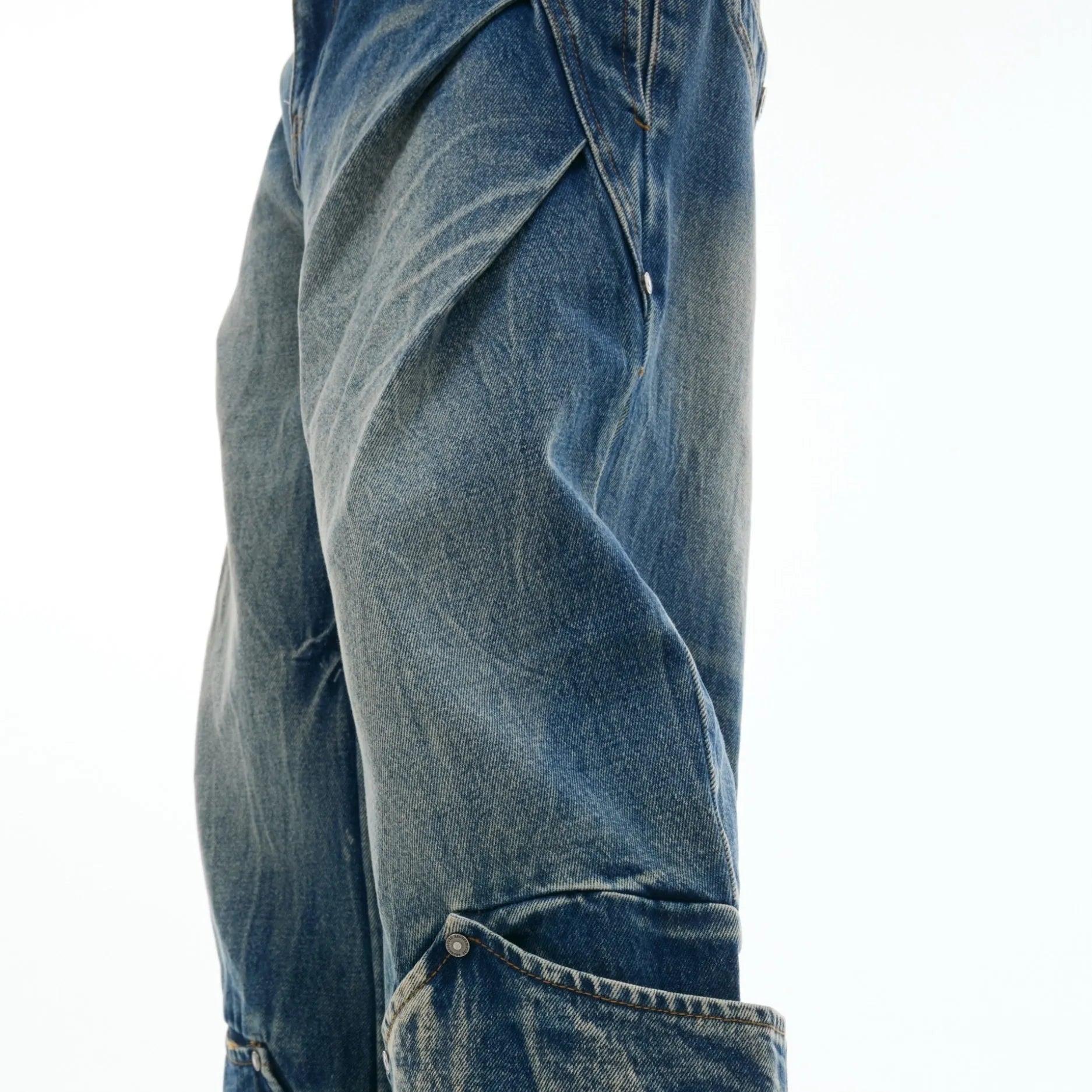 Men's verdant blue loose fit curved knife jeans with retro wash and burst pattern detail