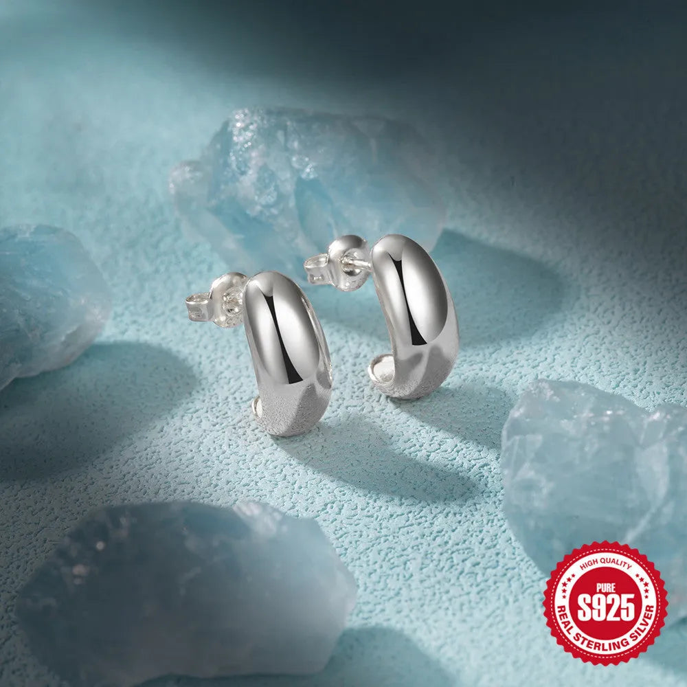 Sterling silver C-shaped stud earrings with glossy electroplated finish in gold or silver tone