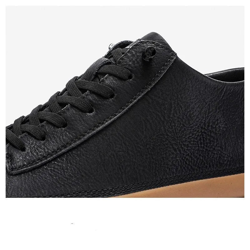 A pair of men's black leather casual shoes with a lace-up front and round toe on a white background.