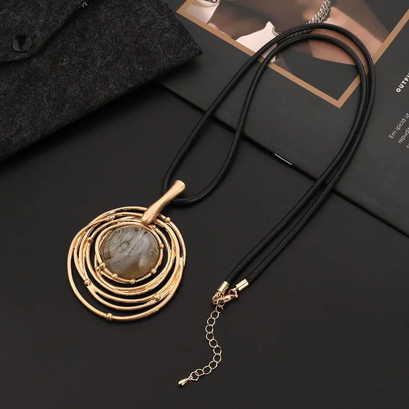 Geometric pendant necklace with snakeskin wax rope chain in gold colour, adjustable length 51-80cm