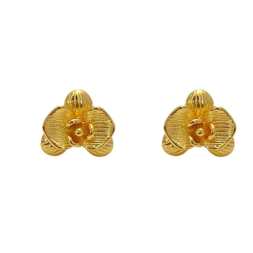 Retro flower fashion earrings in gold or silver electroplated finish with petal details