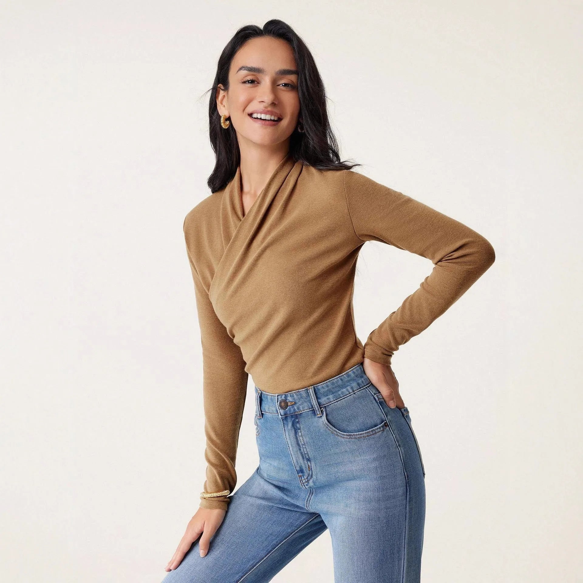 Women's slim fit camel pullover sweater with long sleeves on hanger