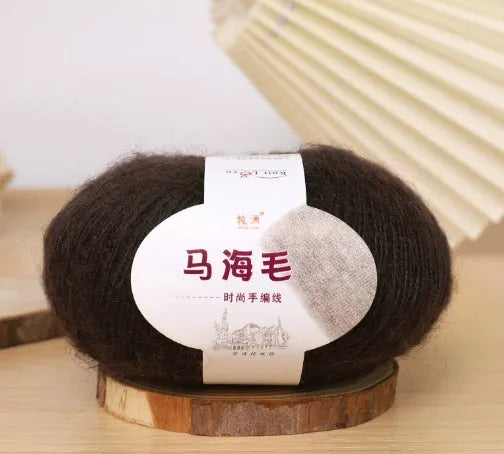 DIY mohair scarf weaving kit showing one wool ball and a selection of 34 colour options including white, pink, blue and green.