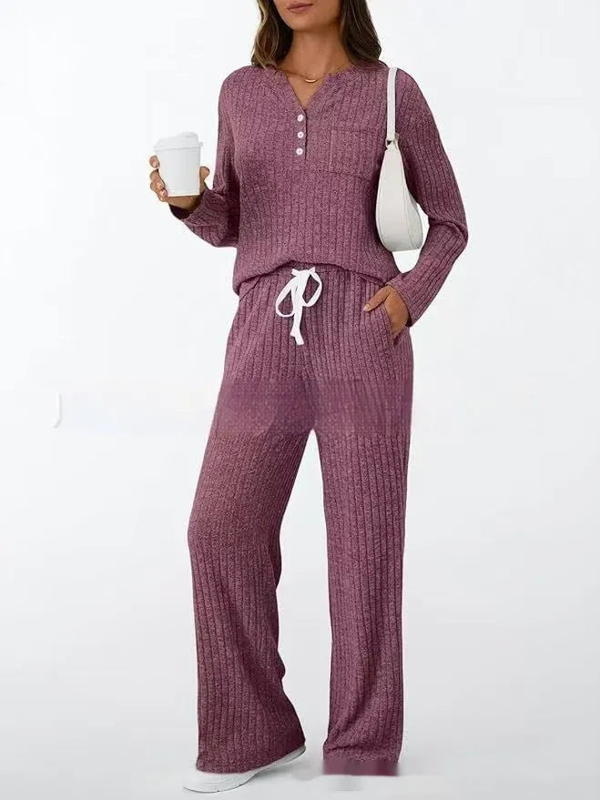 Women's striped knit V-neck long coat in light grey with matching pants, showing lace-up details