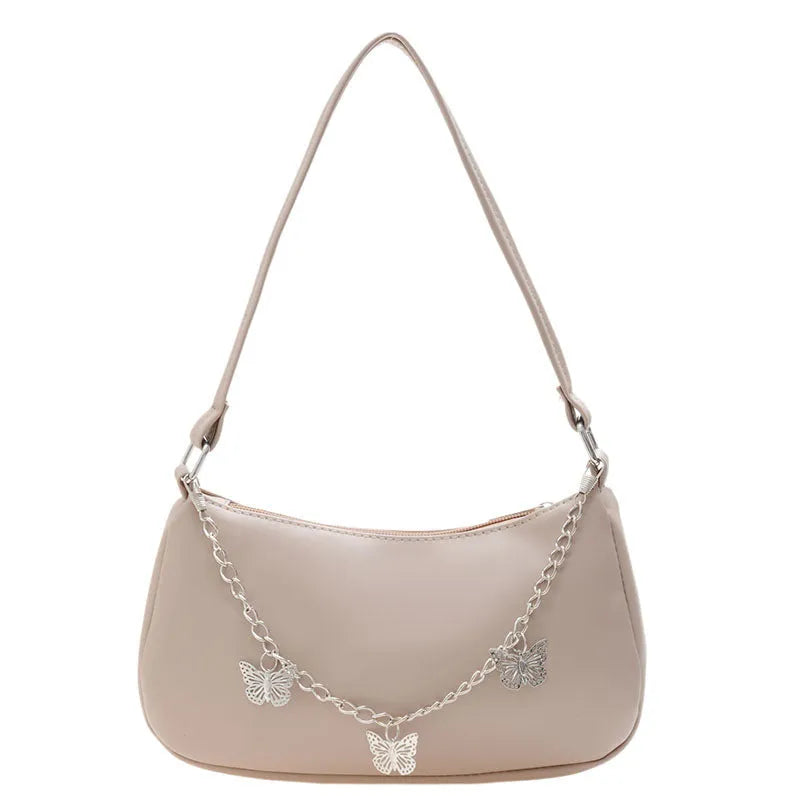 Butterfly chain crossbody bag in PU leather with a retro style, shown in light blue.