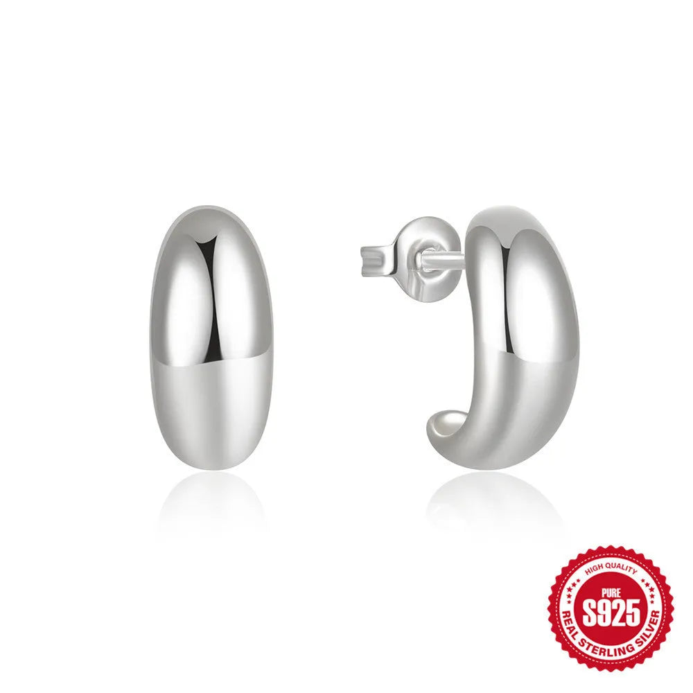 Sterling silver C-shaped stud earrings with glossy electroplated finish in gold or silver tone