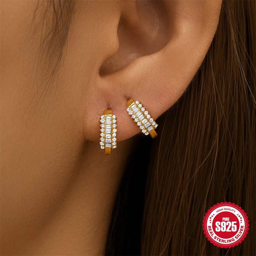 Small round geometric sterling silver stud earrings with a diamond shape, available in gold or silver finish.