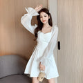 White chiffon patchwork dress with long sleeves and a floor-length skirt on a model, showcasing a slim fit silhouette.