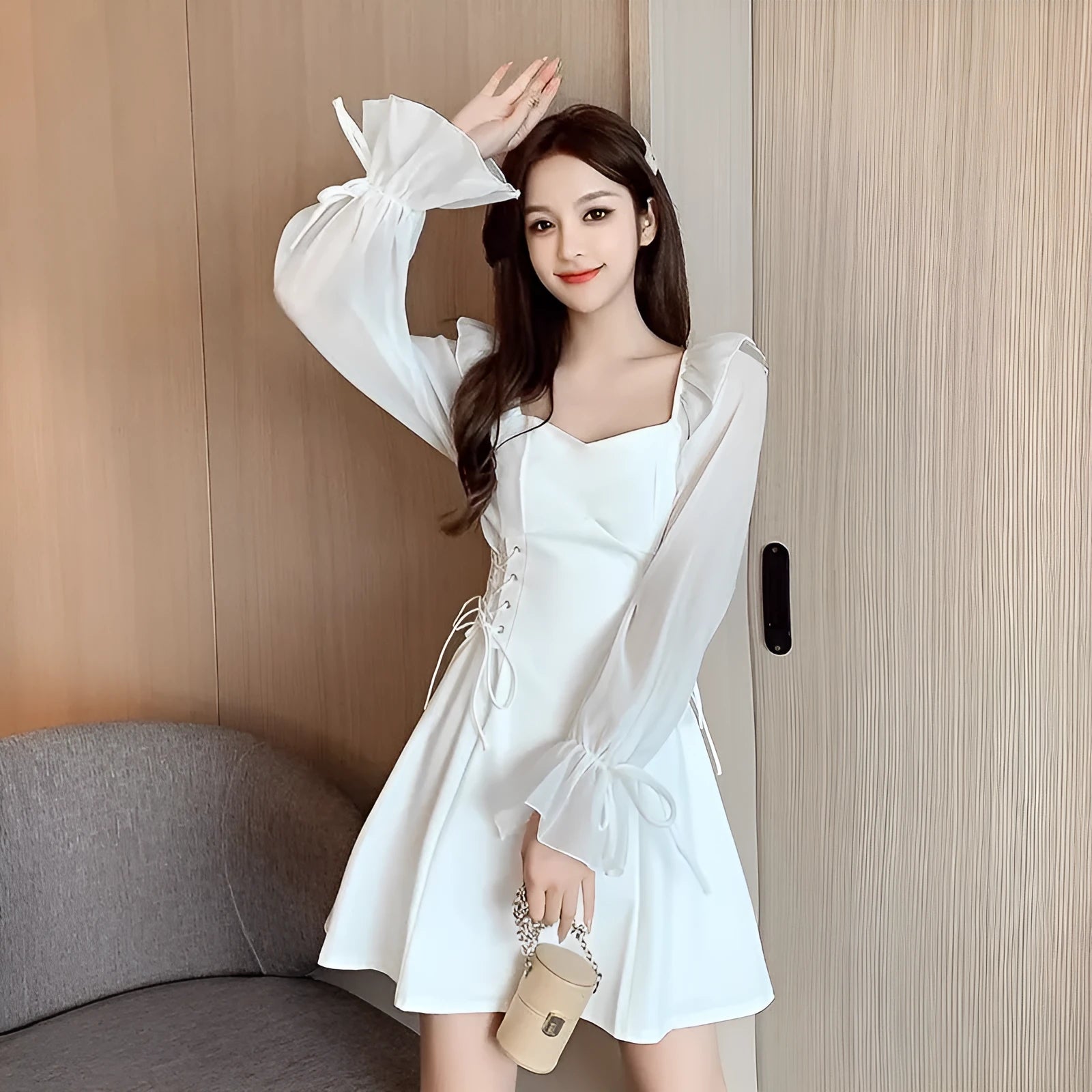 White chiffon patchwork dress with long sleeves and a floor-length skirt on a model, showcasing a slim fit silhouette.