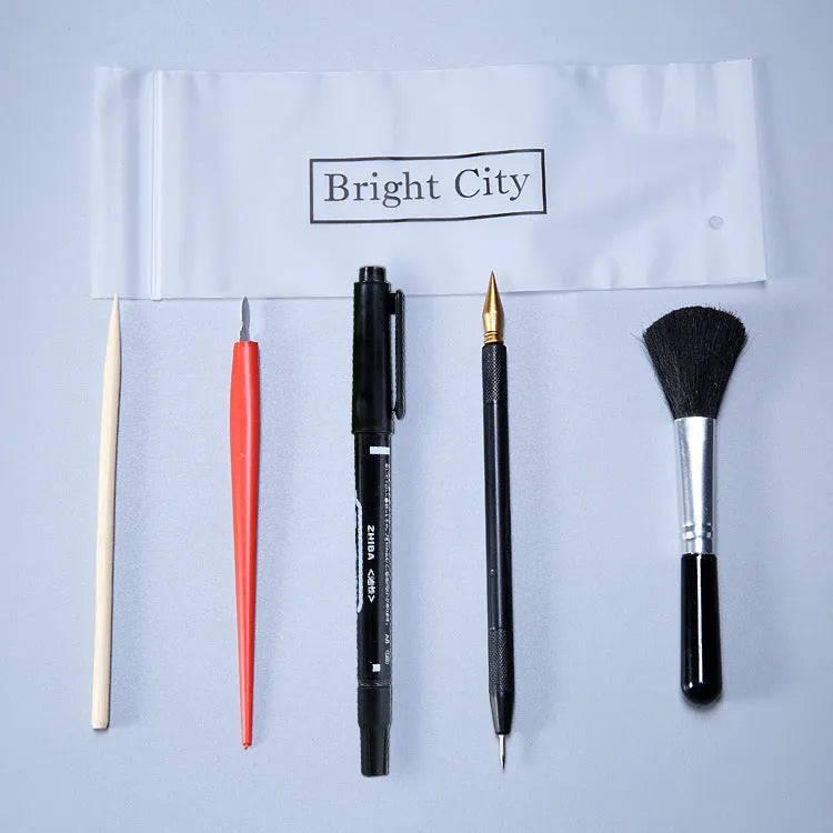 Scraping painting tools kit with white card paper, scraping pens, brushes, and art accessories for scratch artwork