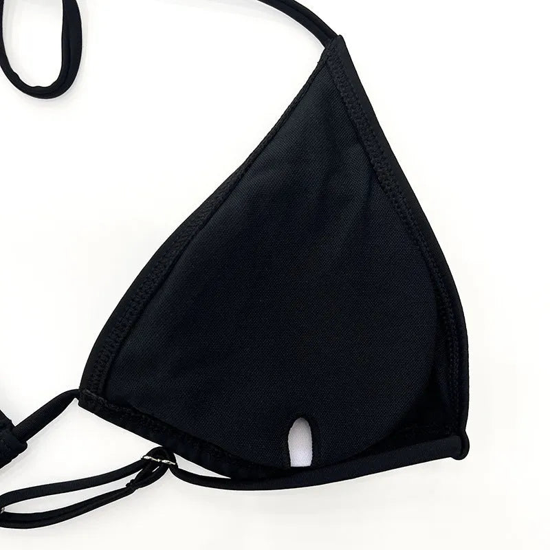 Women's black mesh four-piece bikini set with long sleeves and briefs bottom