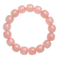 Pink crystal barrel bead bracelet with geometry design and polished finish